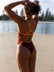 JAYD Swimwear open water swimmer Madi wears the fixed back Lennox one piece in the colour Cinnamon with contrasting sunshine straps and hip cut-outs. This piece offers mid coverage and is comfortable and durable for long training sessions 