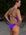 JAYD Swimwear surf ironwoman Jasmine wears the fixed back Lennox one piece in the colours Murasaki with contrasting straps and hip cut outs. This piece is designed in Australia and made from chlorine resistant material.