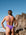 Athletic woman wearing JAYD Swimwear Albi One Piece in Murasaki with high leg cut, supportive design, and chlorine-resistant fabric