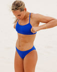 Side view of the supportive JAYD Swimwear Torquay Bikini Top in Cobalt blue.