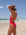 Side view of Tallow One Piece Athletic Swimsuit in Ruby Red, by JAYD Swimwear.
