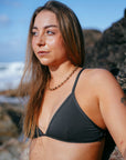 JAYD model Cass wearing the Kiama one piece bikini top on the beach, a popular triangle style classic that is practical, stylish and functional.
