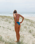 Jess wears JAYD Swimwear Lennox one piece swimsuit in Nordic.