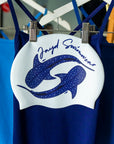 two whale sharks swimming in a circle with JAYD Swimwear branding on a white swim cap.