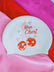 White JAYD swim cap on a pink background with cherry disco balls and text 'Mon Cheri'.
