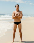 Front view of Ramshark Mens Briefs in Black by JAYD Swimwear.