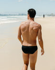 Back view of Ramshark Mens Briefs in Black by JAYD Swimwear.