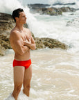 Ocean side view of Ramshark Mens Briefs in Red by JAYD Swimwear.