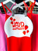 White swim cap with red JAYD Swimwear text and floating strawberries.