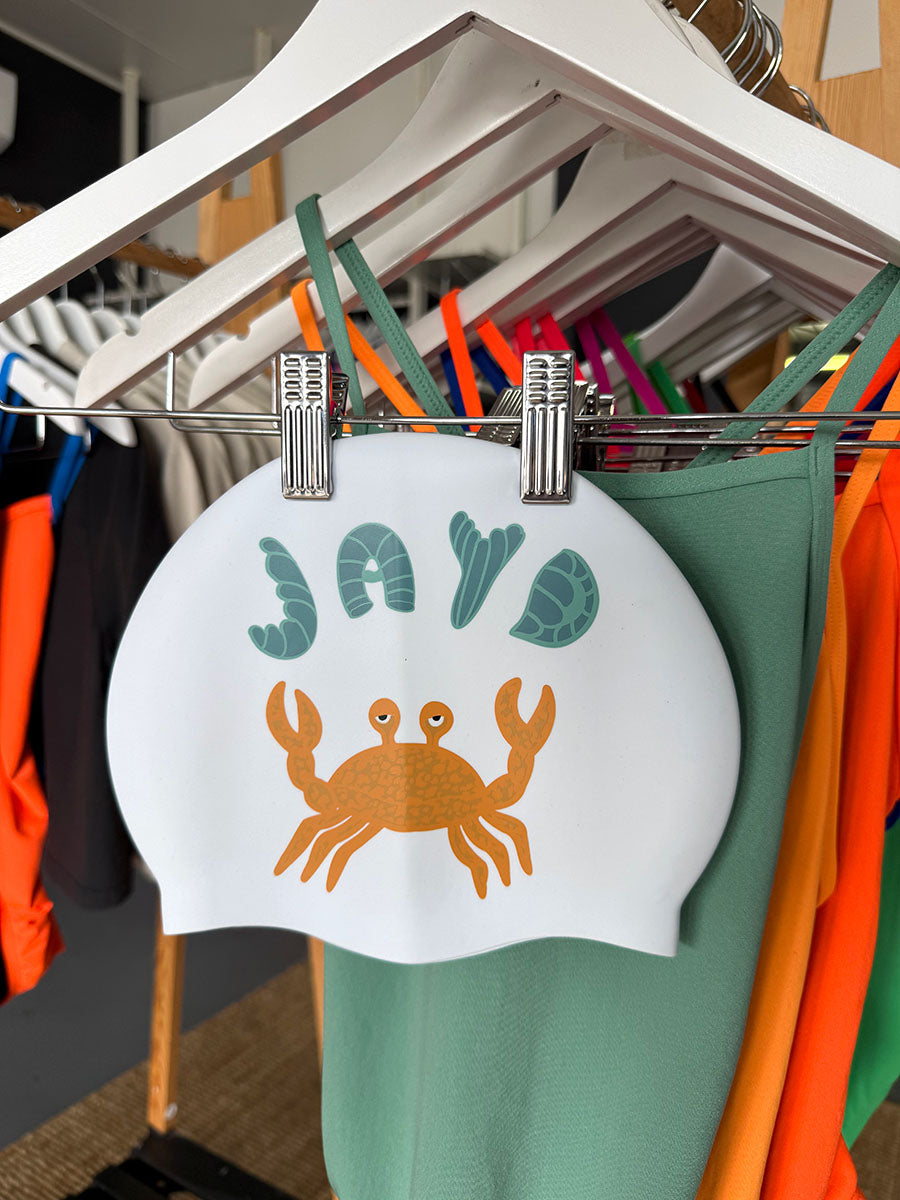 Feeling crabby? This JAYD Swim Cap is here to lift your mood with a unique crab design that matches out Matcha, Sunshine or Cove One Piece swimsuits.