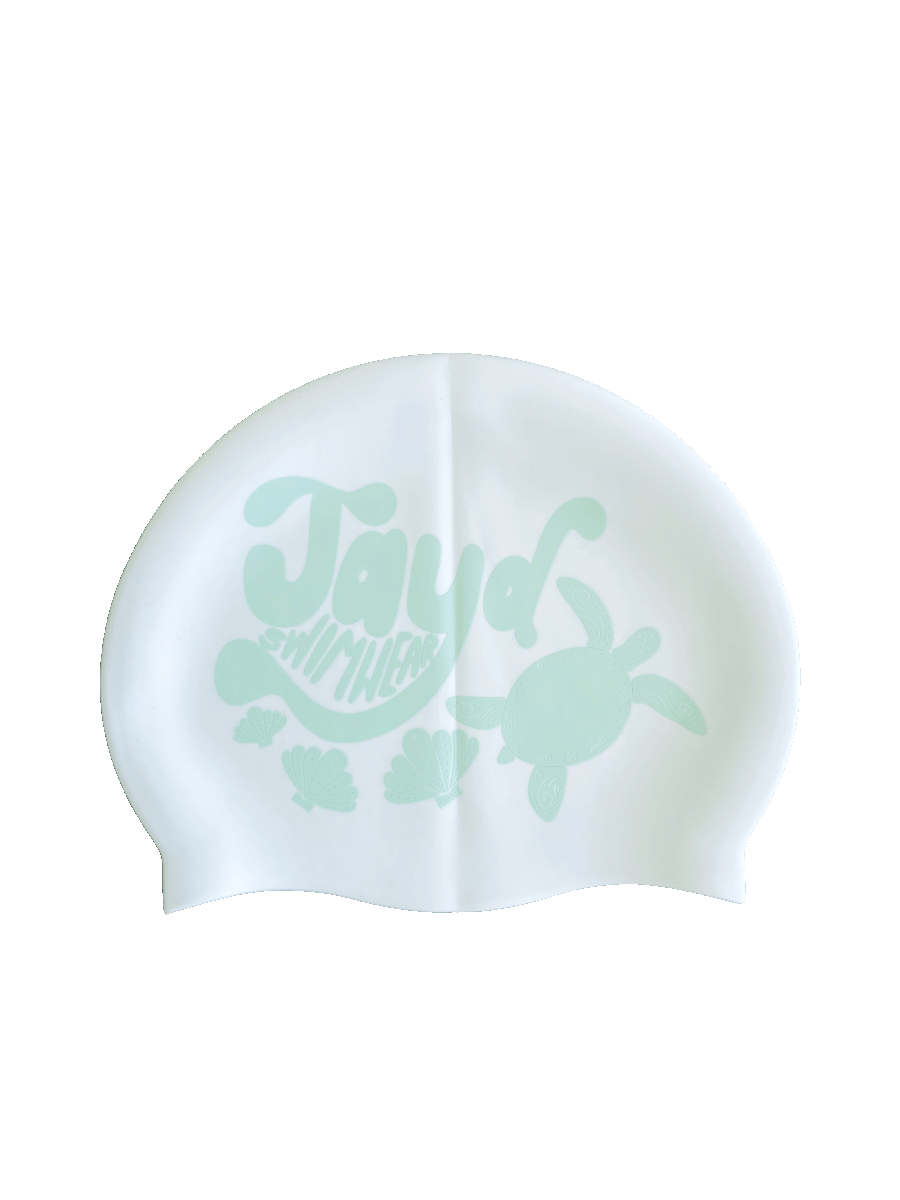 Side B: JAYD Swim Cap complete with shells and turtles. Embrace the ocean vibes with your next swim.