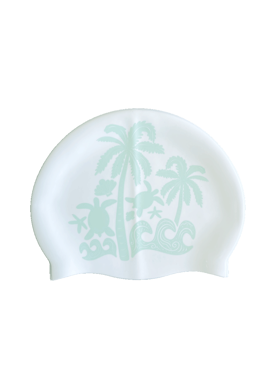 Side A: Tropical turtles, breezy palms and rolling waves creating full island energy. The ideal JAYD Swim Cap for swimmers wanting chilled beach vibes as they glide through every lap.