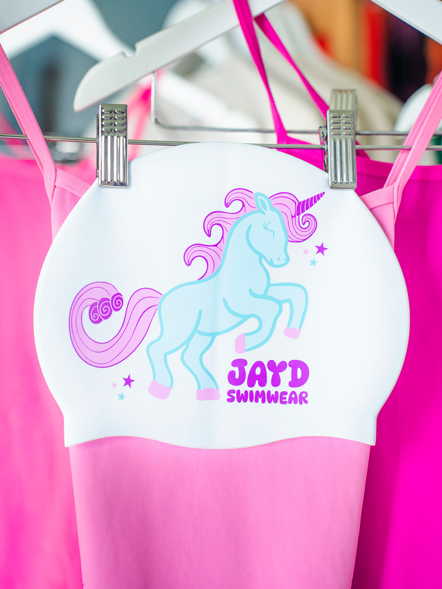 Blue and pink unicorn with JAYD Swimwear writing on a swim cap.