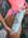 JAYD model holding the mint green water bottle with JAYD Swimwear logo in bubble font.