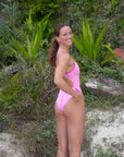 Swimmer Molly just can't get enough of the fixed-back JAYD Swimwear Zambia Fairy Floss One Piece. She is a huge fan of this swimsuit's bold pink sorbet shoulder straps, side cutout and mid-coverage fit.