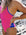 JAYD Swimwear IBIZA One Piece in Pink Sorbet with Cobalt blue contrasting straps and hip cutouts, worn by ocean athlete Olivia Corrin for high-performance training.