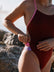 Athlete wearing the IBIZA chlorine resistant one piece designed by JAYD Swimwear. Swimsuit core colour is Cinnamon with Fairy floss contrasting straps.  