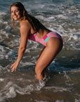 Athlete wearing the IBIZA chlorine resistant one piece designed by JAYD Swimwear. Featured colour is Fairy floss with contrasting hip cut outs. 